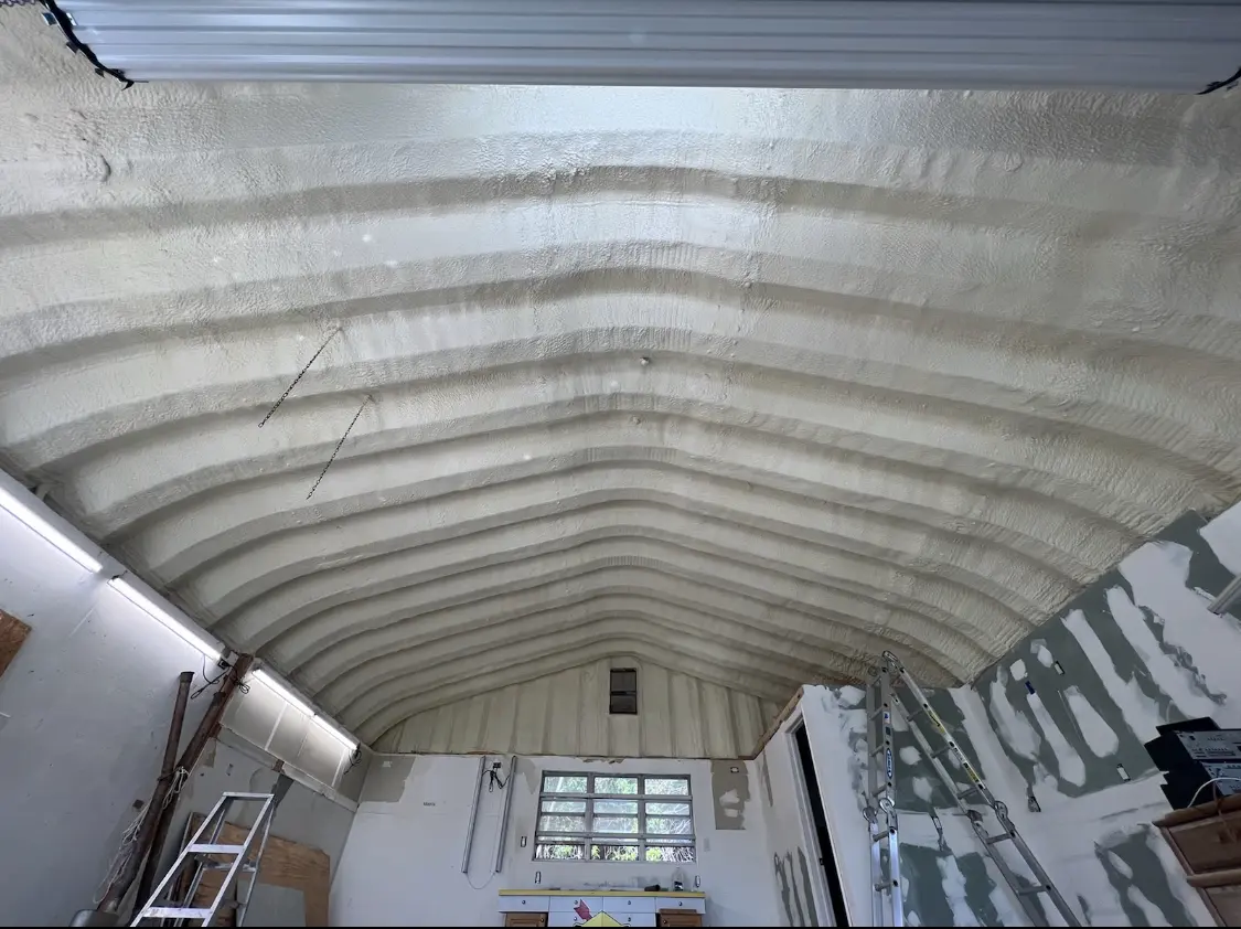 Spray polyurethane foam applied to the underside of a metal roof deck in Hamilton